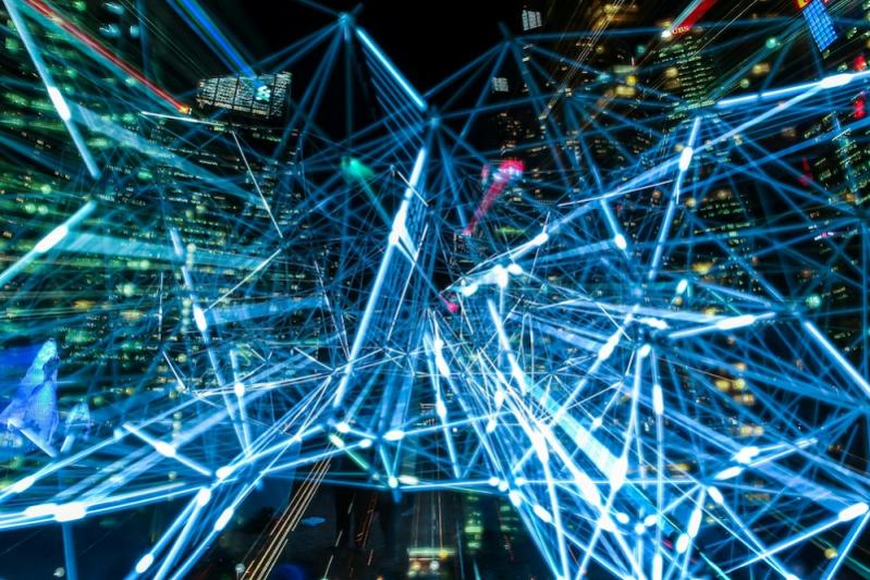 Interconnected light trails representing digital communication networks.
